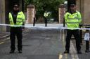 Police at the Abbey gateway of Forbury Gardens in Reading town centre following the multiple stabbing attack (Jonathan Brady/PA)